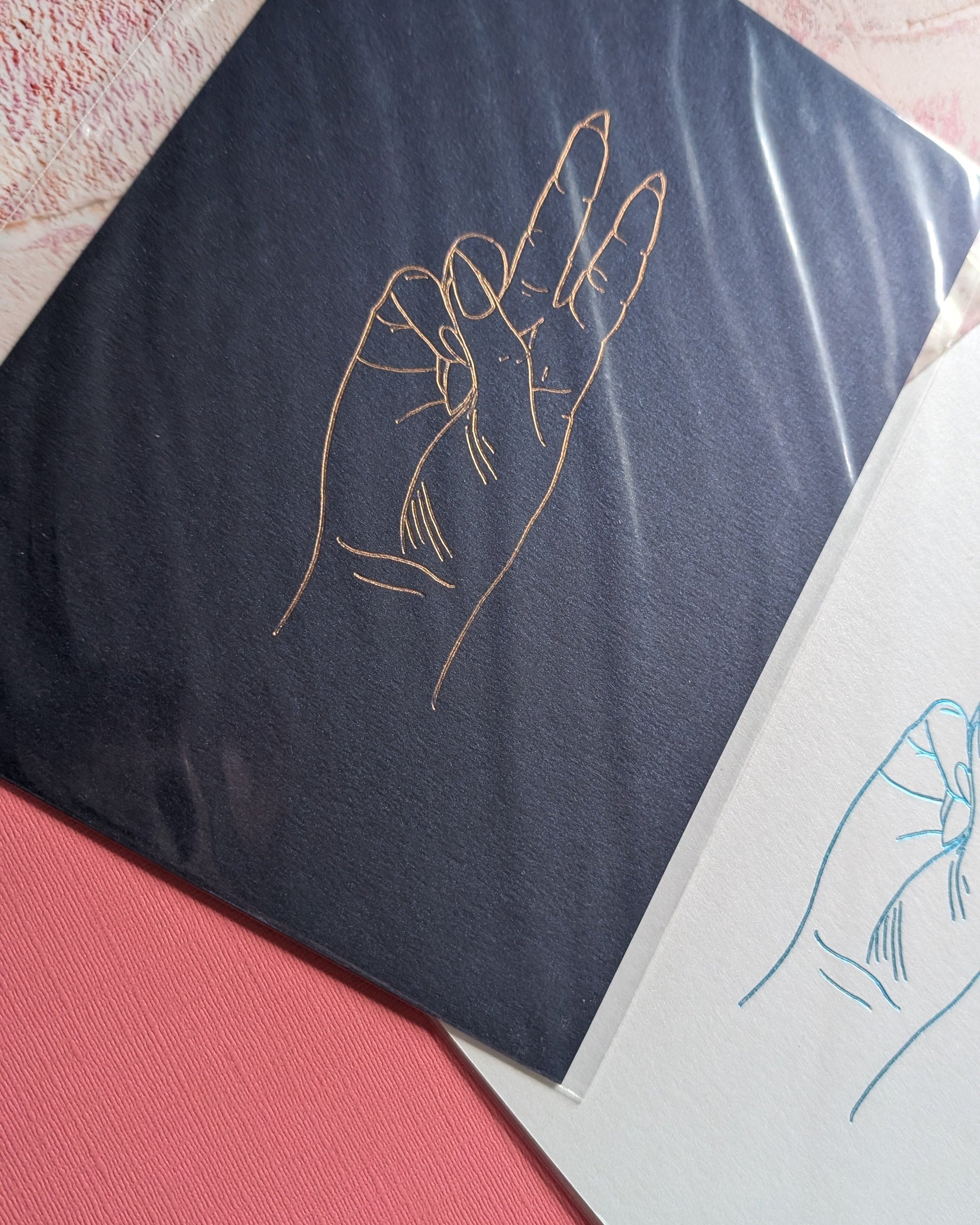 Navy Print with gold foil in the shape of the hand peace sign