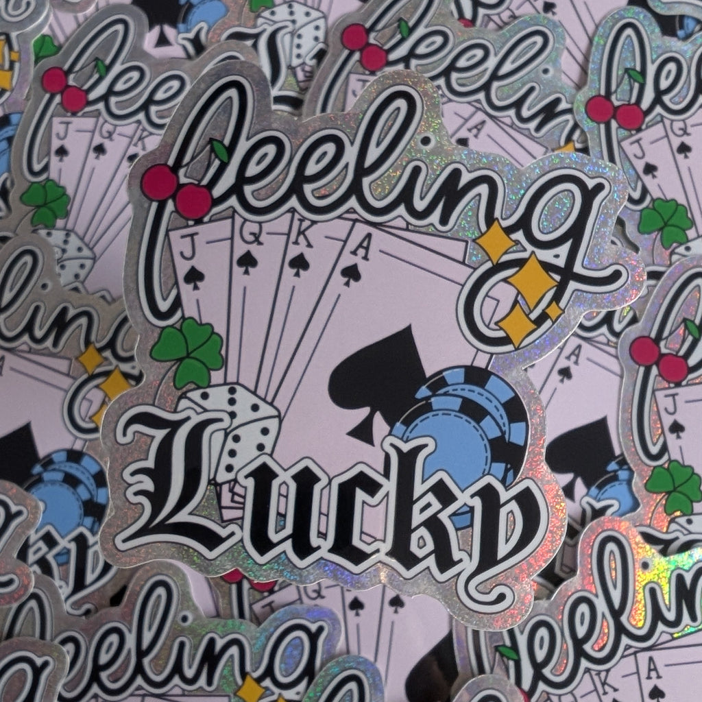 Stickers with 'Lucky Feeling' text and playing card symbols on a patterned background