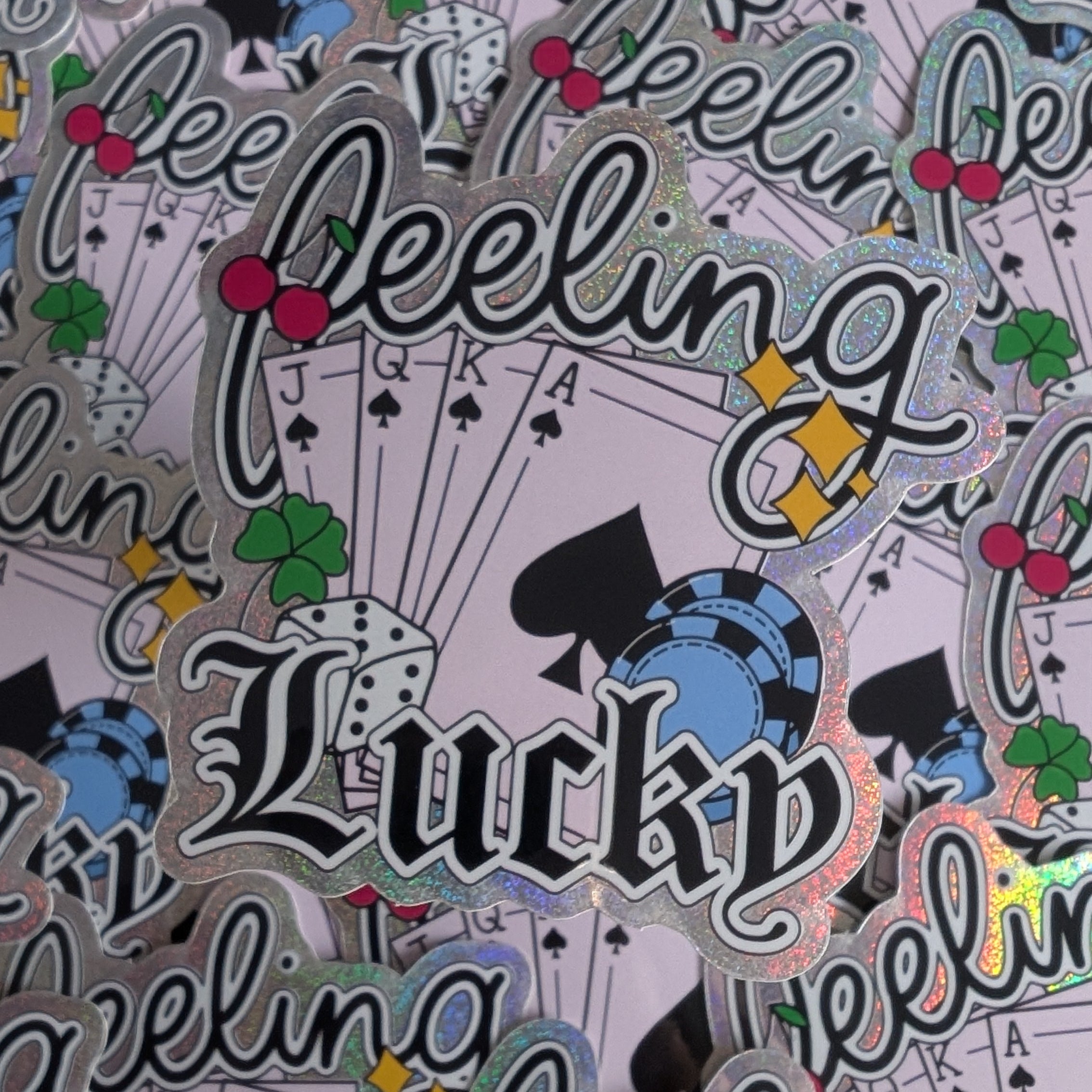 Stickers with 'Lucky Feeling' text and playing card symbols on a patterned background