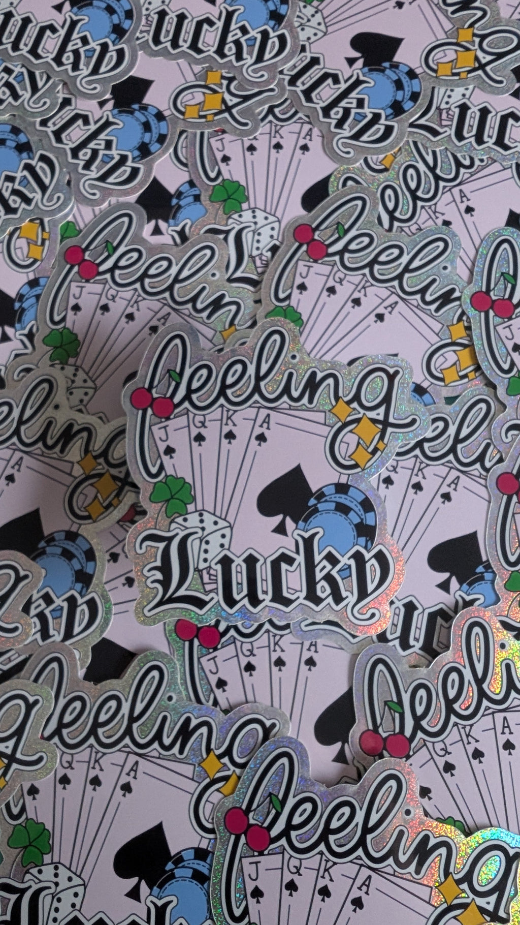 Stickers with 'Lucky Feeling' text and graphics on a patterned background