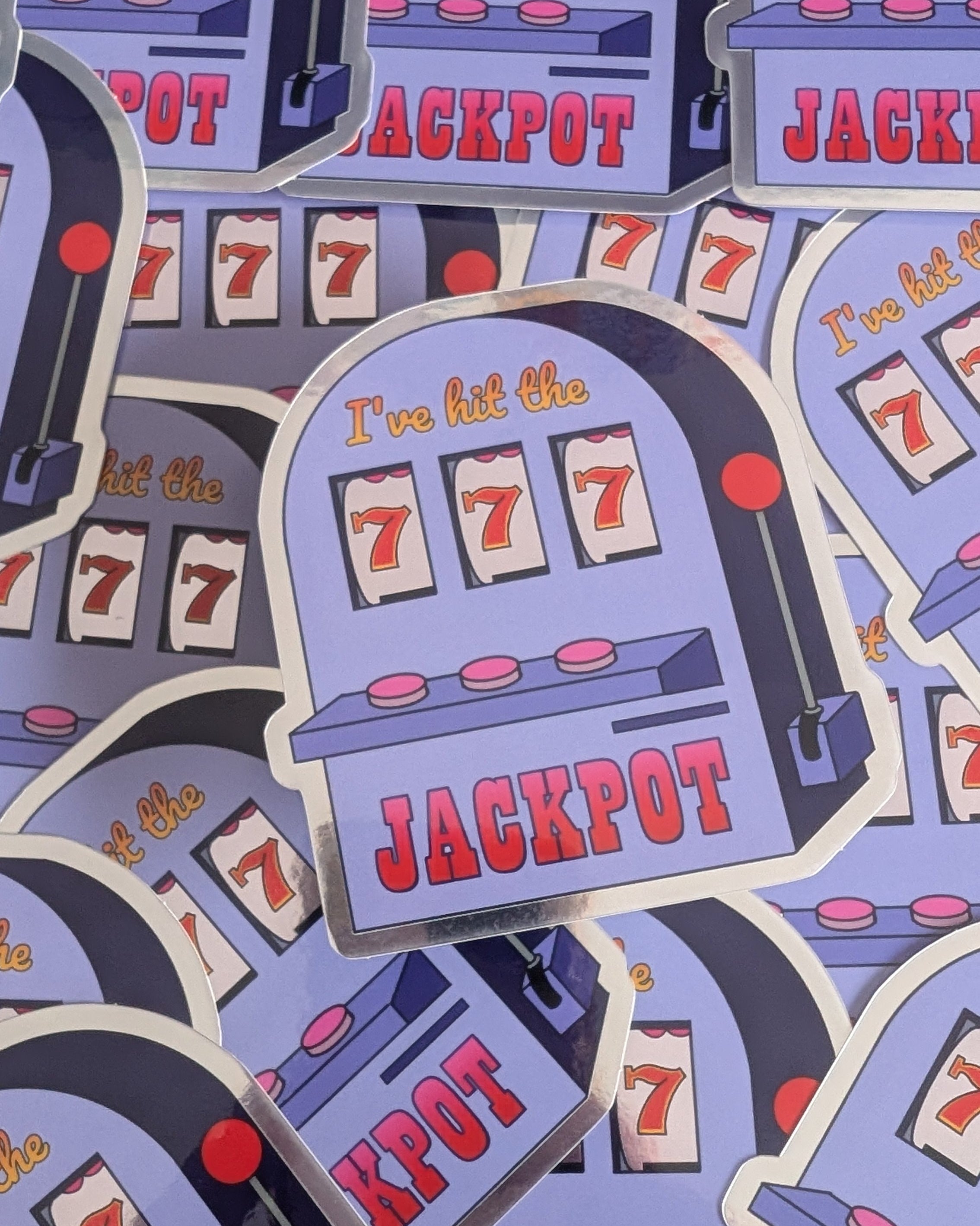 Stickers of slot machines with 'JACKPOT' text on a blue background